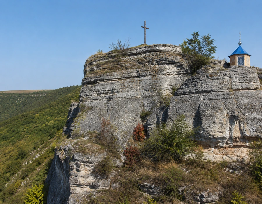 Saharna Monastery in forested gorge with cliffs and Dniester River valley